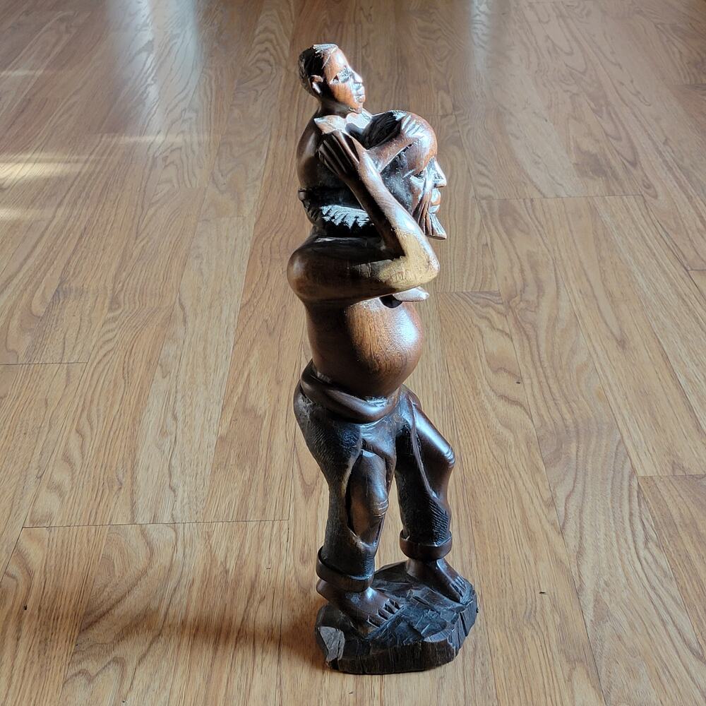 Vintage iron wood carving African man with child figurine sculpture